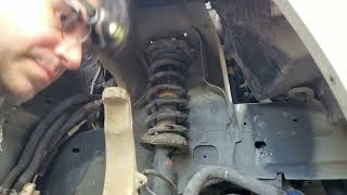 Jeep Commander 20052010 front coilshock replacement and clevis bracket bolt removal [upl. by Iggam677]