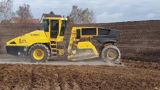 MAN TGX spreading and BOMAG RS 500 milling soil [upl. by Nwahsar]