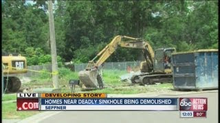 Demolition begins on homes near sinkhole [upl. by Ymmit130]