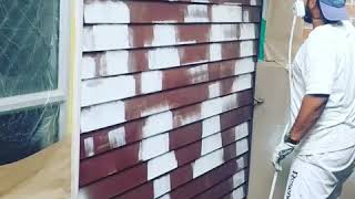 Airless spraying weatherboards [upl. by Munroe]