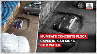 Mumbai car that caved into concrete floor pulled out using rope [upl. by Philomena639]